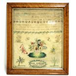 An early-mid 19th century needlework sampler by Eliza Edmonds, aged 9, worked in coloured silks with