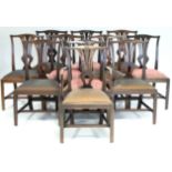 A SET OF ELEVEN GEORGE III MAHOGANY DINING CHAIRS, including one elbow chair, with carved Prince-of-