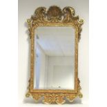 A George II style rectangular wall mirror in gilt & painted composition scroll frame with scallop-