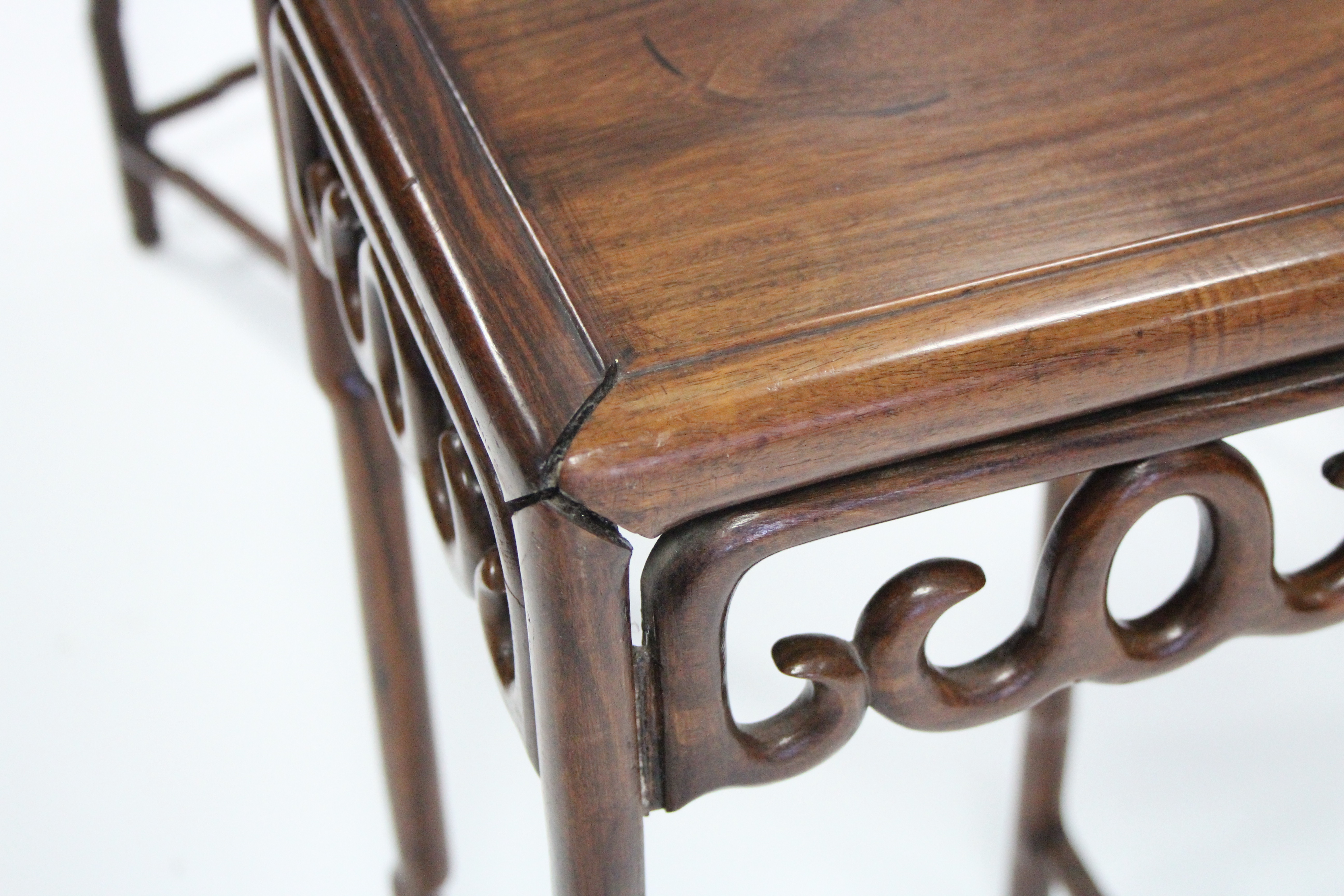 A nest of four Chinese hardwood occasional tables with pierced frieze, on faux-bamboo legs & - Image 5 of 6