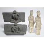 A pair of early Indian carved grey stone frieze fragments, each of rectangular shape with seated