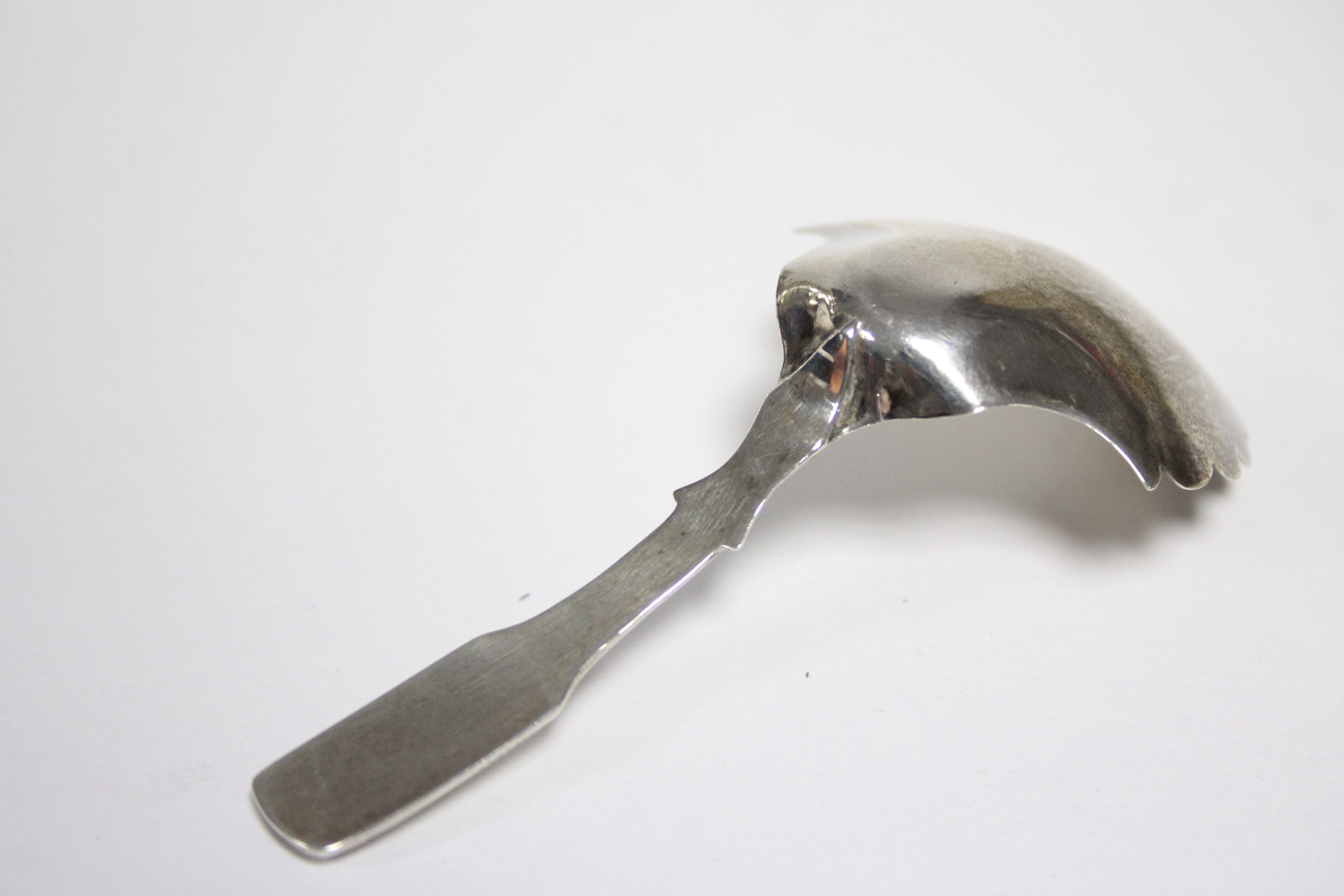 A George IV Fiddle pattern caddy spoon, the rounded shovel bowl with scalloped rim & engraved floral - Image 2 of 3