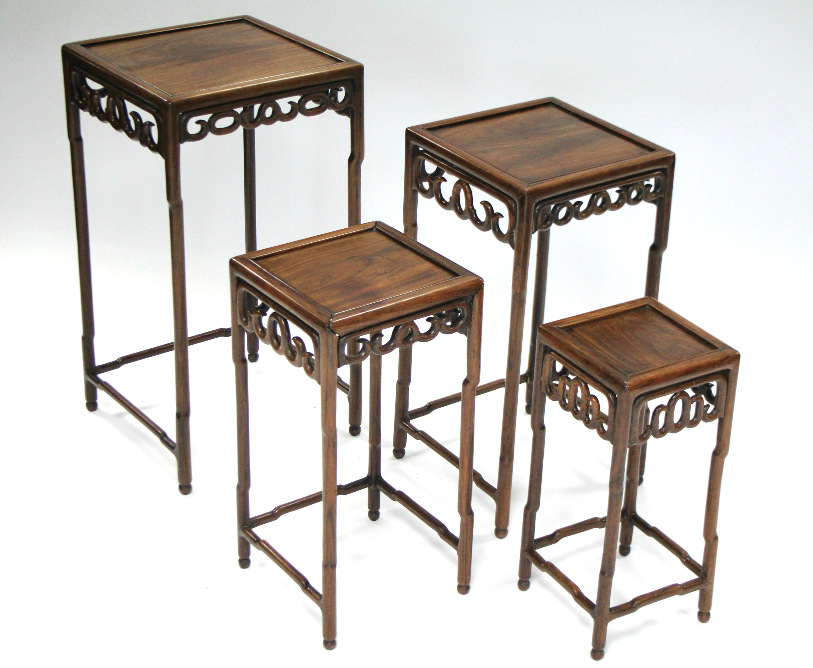 A nest of four Chinese hardwood occasional tables with pierced frieze, on faux-bamboo legs & - Image 2 of 6
