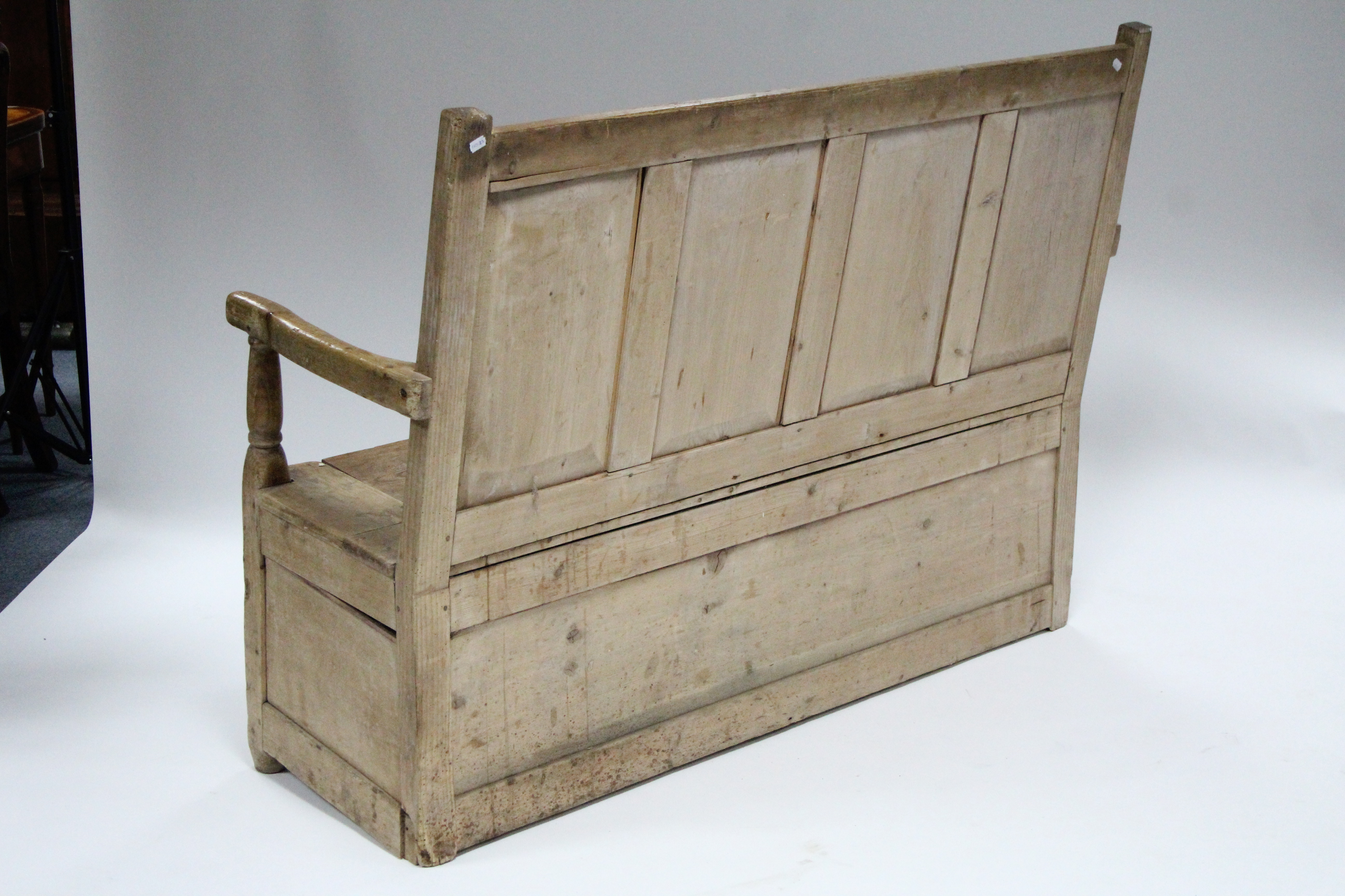 A 19th century pine box-seat settle with panelled back & open arms; 54” wide. - Image 4 of 4