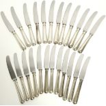 Twelve steel table knives with silver Old English Thread handles, & twelve matching dessert