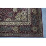 AN EARLY 20th CENTURY LARGE PERSIAN PATTERN RUG BY JEFFERIES OF NORTHAMPTON, of deep crimson ground,