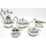 A four piece melon-shaped tea & coffee service with acorn finials, leaf-scroll handles, & on