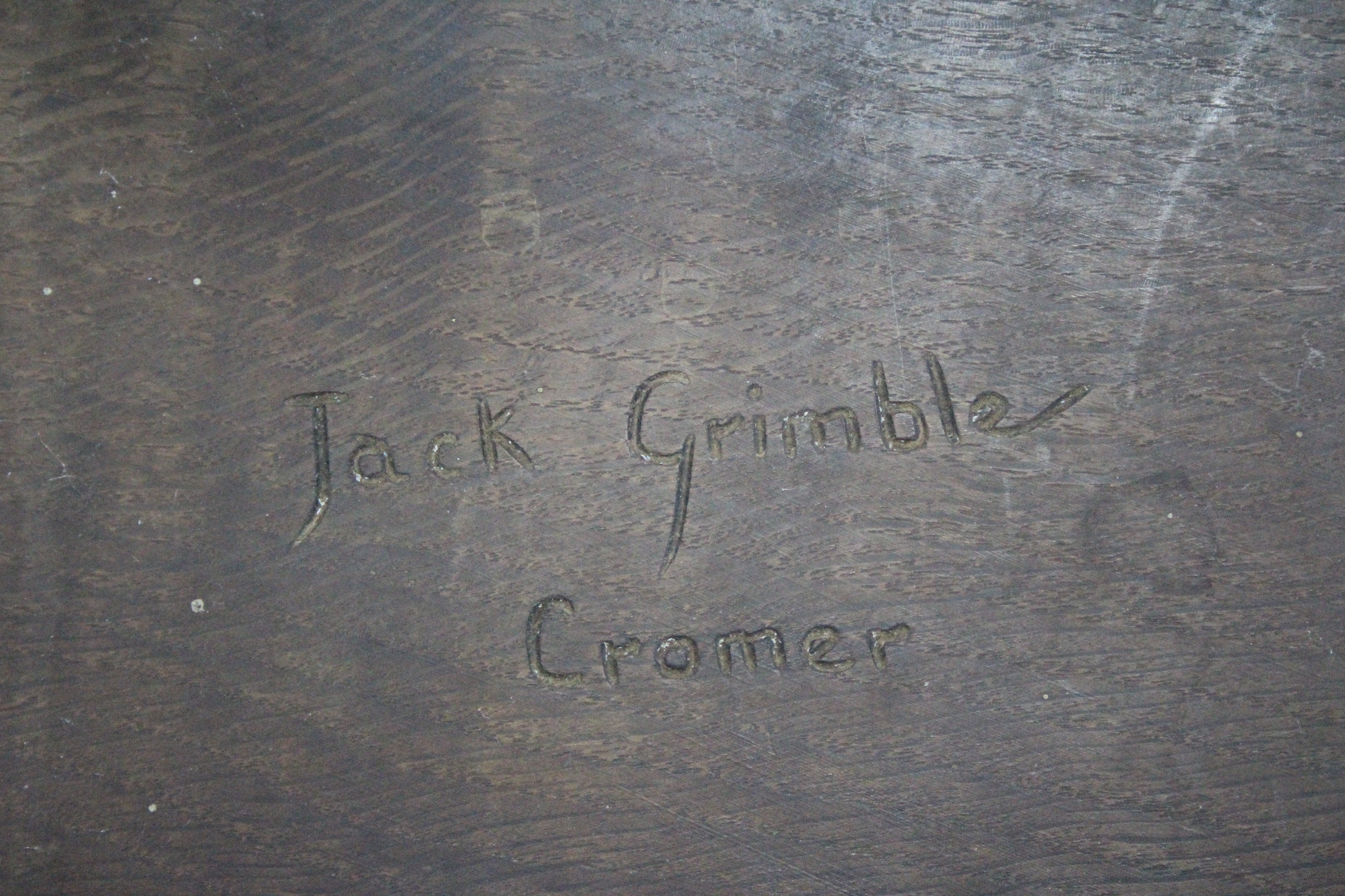 An oak milking stool by JACK GRIMBLE, the shaped seat with carved Tudor rose, on three chamfered - Image 4 of 4