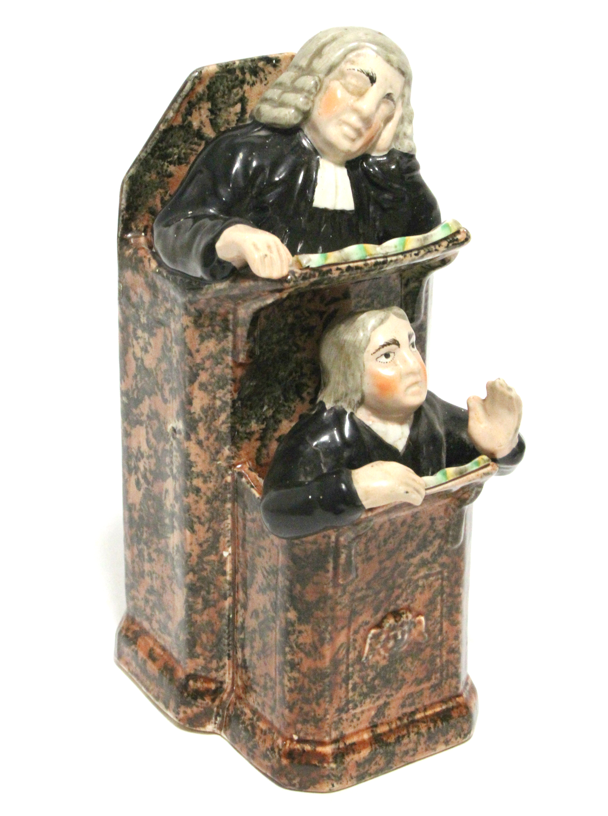 AN EARLY 19th century STAFFORDSHIRE POTTERY GROUP OF “THE VICAR & MOSES” of typical form, the pulpit