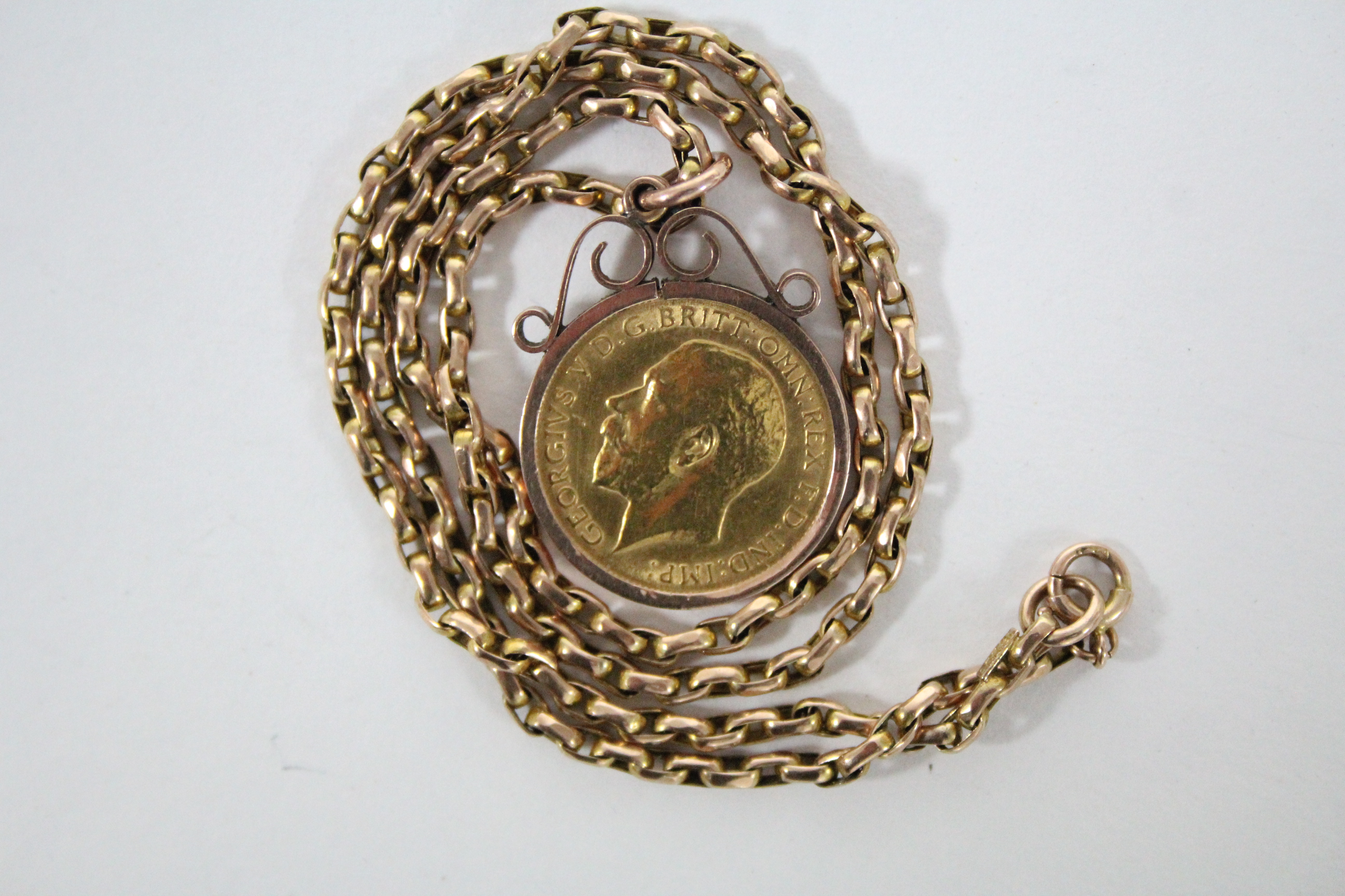 A George V half-sovereign, 1915, loose-mounted as a pendant, on 9ct. gold chain necklet. - Image 2 of 2