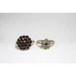 A 9ct. gold ring set cluster of blue & white sapphires; a gold ring set garnet cluster; & a pair