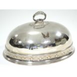 A late Victorian domed oval dish cover with ring handle & engraved border, & family crest. 15” x