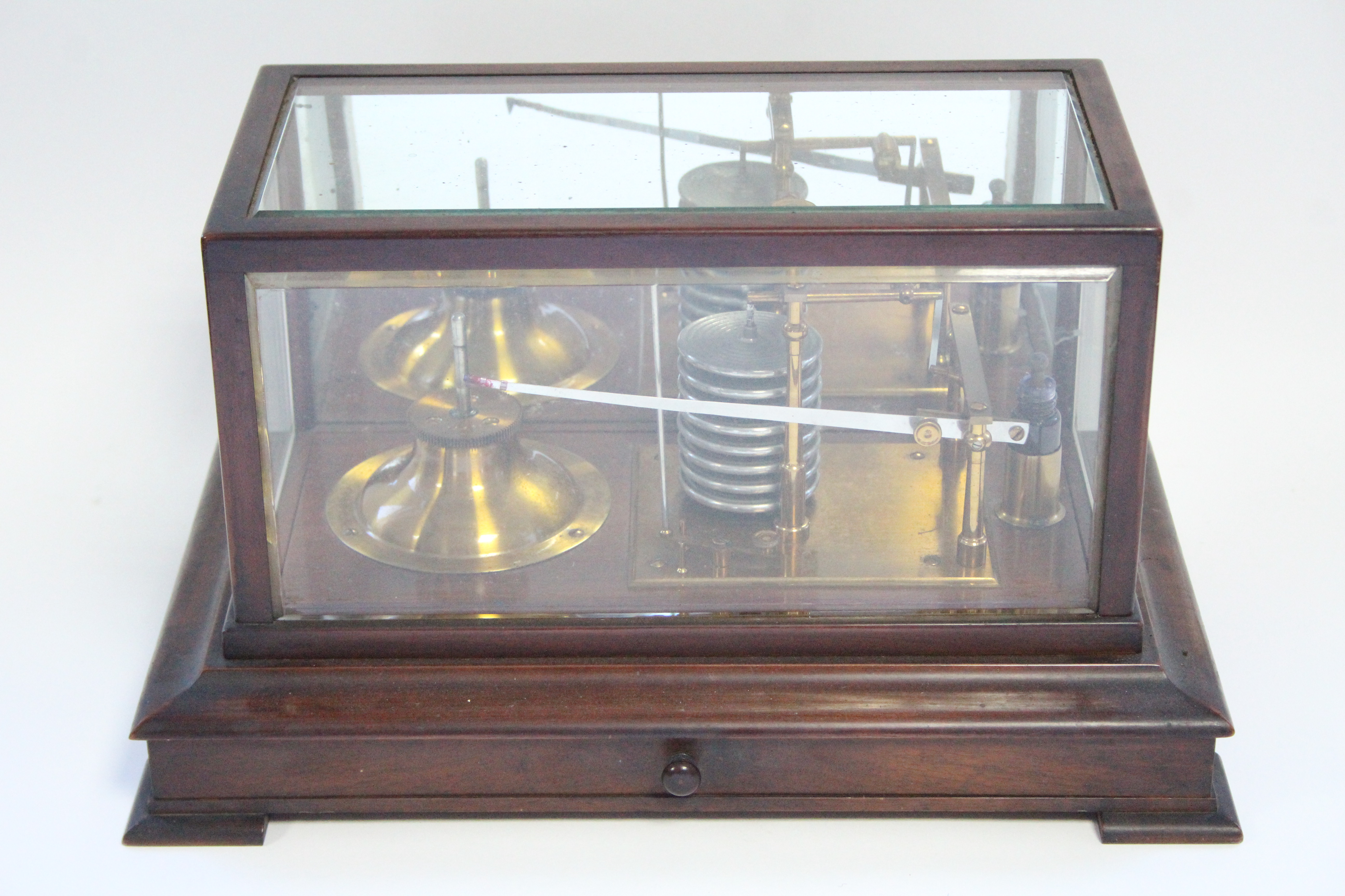 An early 20th century barograph in mahogany case with bevelled glass to the top & all sides,