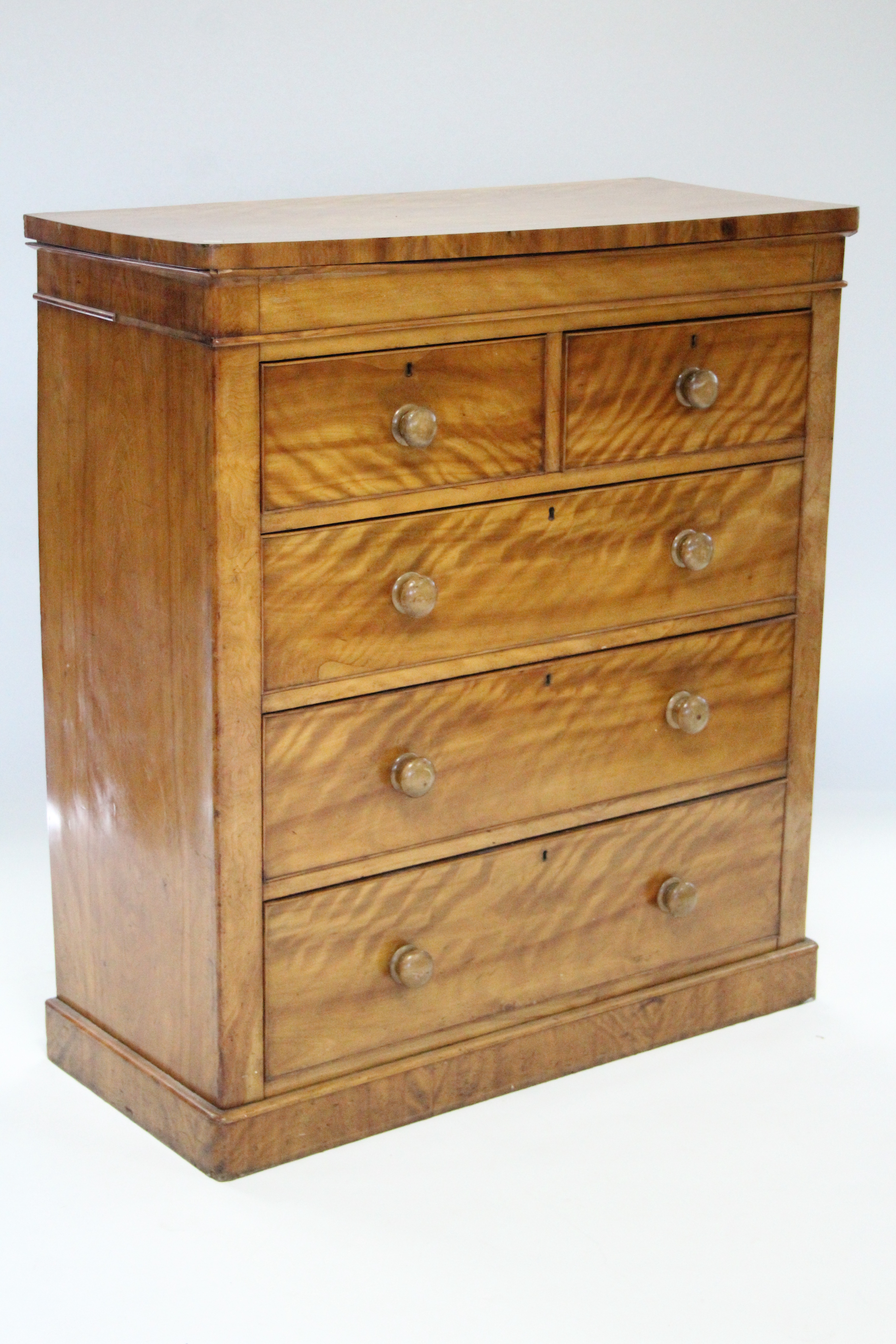 A Victorian satin birch chest fitted two short & three long graduated drawers with turned knob