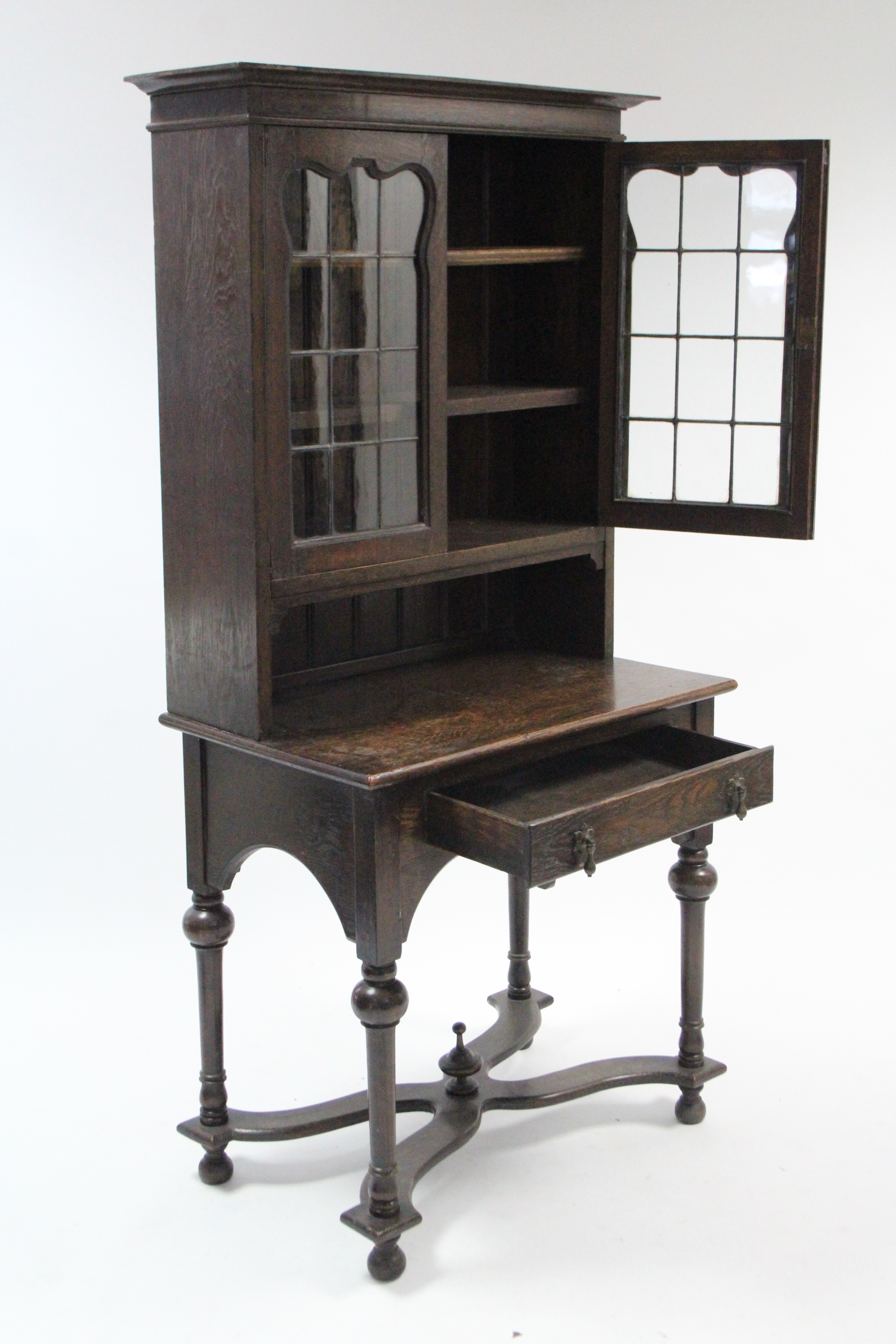 A 1930’s oak small bookcase the upper part with two adjustable shelves enclosed by pair of leaded - Image 2 of 2