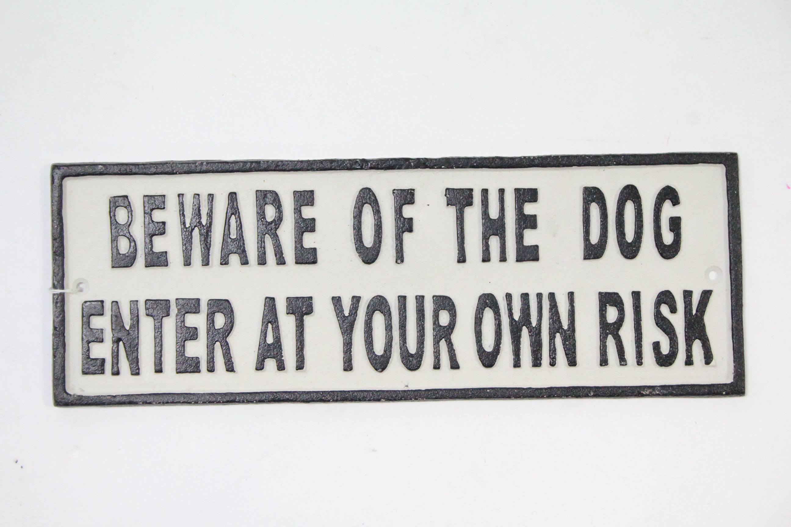 A reproduction painted cast-iron rectangular sign “BEWARE OF THE DOG ENTER AT YOUR OWN RISK”, 5” x