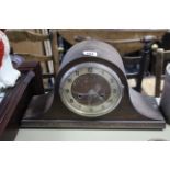 A 1930’s mantel clock in oak domed-top case, 8¾” high; together with a modern wall clock; a