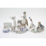 A collection of nine various Lladro ornaments.