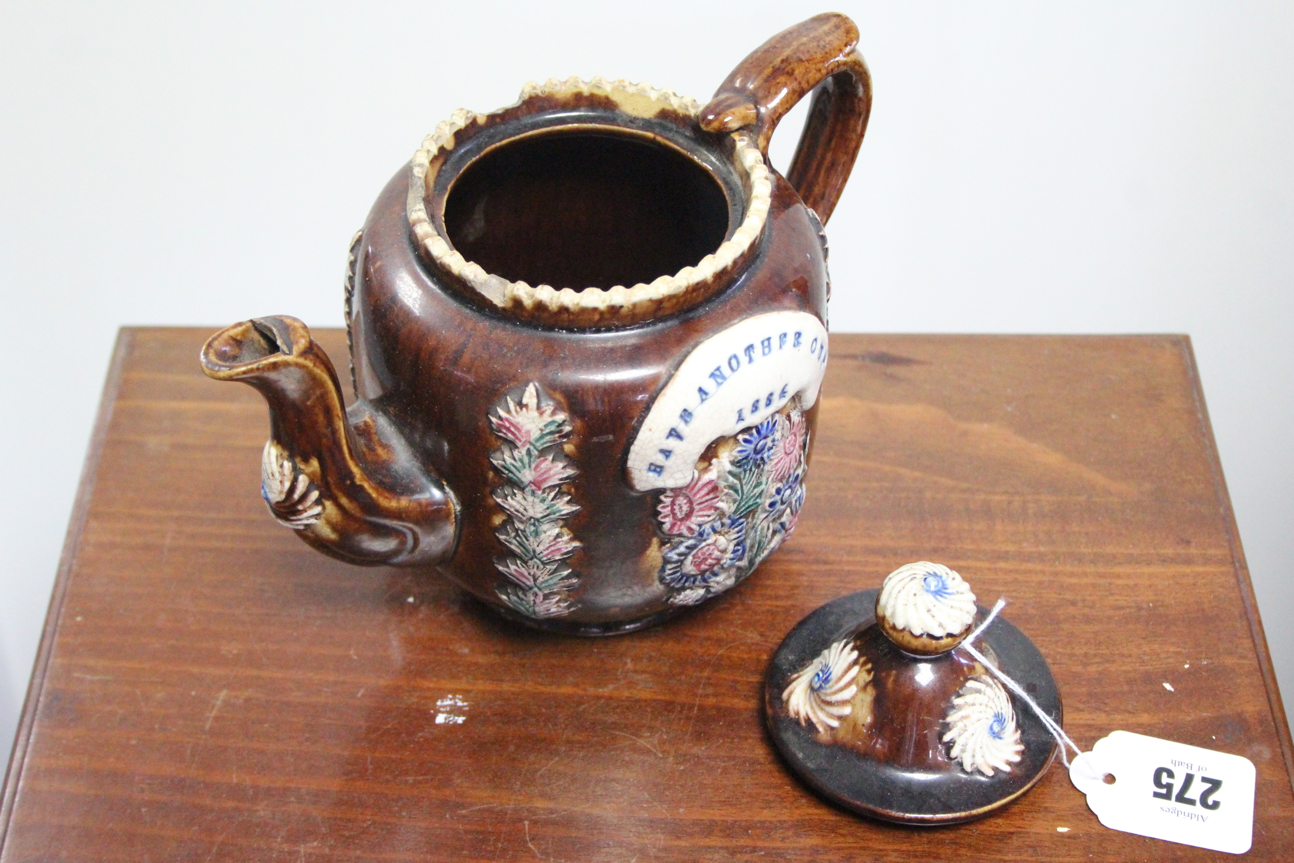 A late 19th century treacle glazed barge ware teapot (1884), 6¾” high; a Quimper ware jardinière, 6” - Image 3 of 4