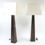 A pair of Natuzzi (Italian) laminate & chrome finish floor-standing lamps each of square tapered