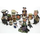 A collection of twelve various toby jugs & character jugs; & four composition Laurel & Hardy