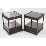 A pair of reproduction mahogany square two-tier occasional tables, each fitted drawer to the lower