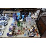 Four glass paperweights; various decorative drinking vessels; various other items of glassware; &