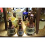 Six Wade “Bells Scotch Whisky” bell-shaped decanters (lacking contents); five various water jugs;