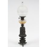 A Victorian bronzed oil table lamp with opaque & clear globular shade, with cut-glass reservoir,