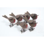 Six modern lithographed tinplate robin ornaments, 4” high.