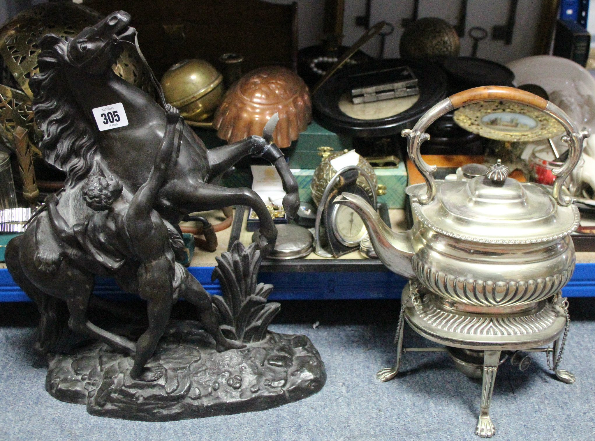 A Spelter model of a Marley horse, 16” high; a silver plated spirit kettle; a stationary rack; &