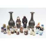 A collection of salt & pepper pots; together with a pair of Daalderop (Dutch) vases; & various