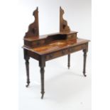 A late Victorian mahogany dressing table (lacking mirror) fitted two frieze drawers, & on ring-