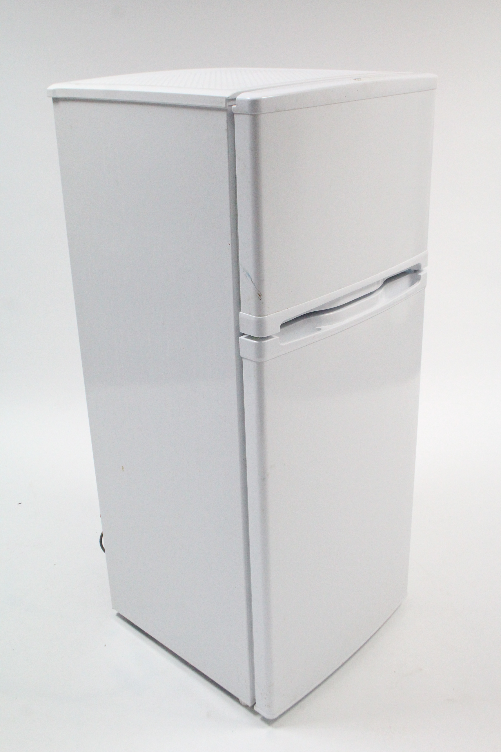 A small upright fridge-freezer in white finish case, w.o. 44½” high.