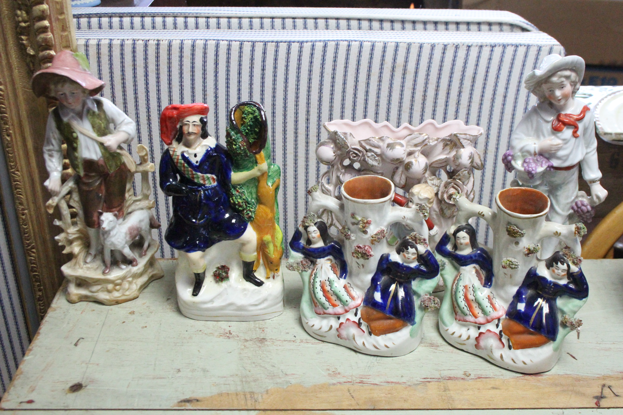Three Staffordshire pottery flat-back spill vases; nine bisque figures, etc.