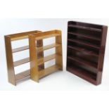 A pine six-tier standing open bookcase, 35” wide x 44” high; & a pair of oak four-tier standing open