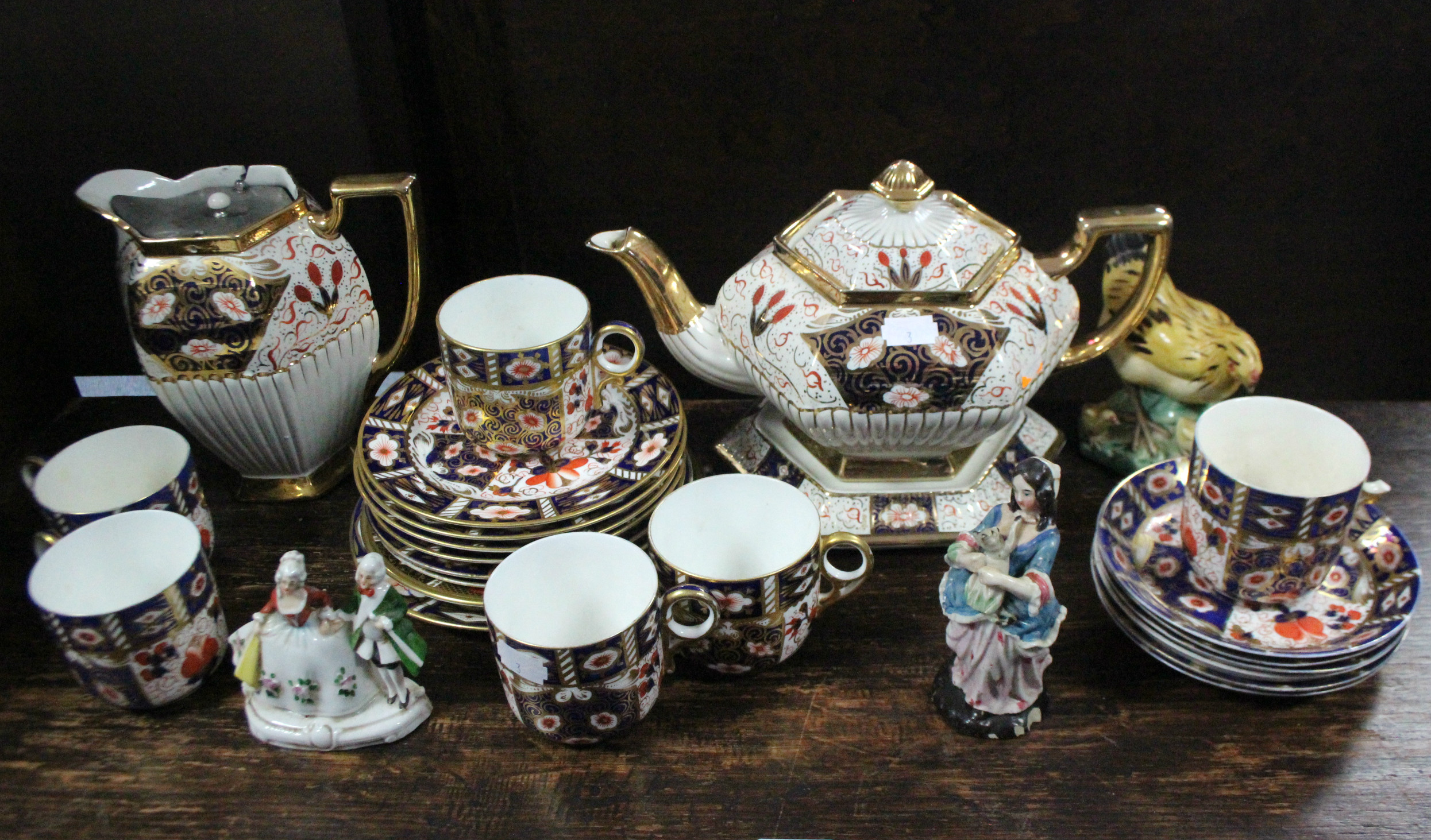 A set of six Royal Crown Derby floral decorated side plates; a similar twelve-piece part tea