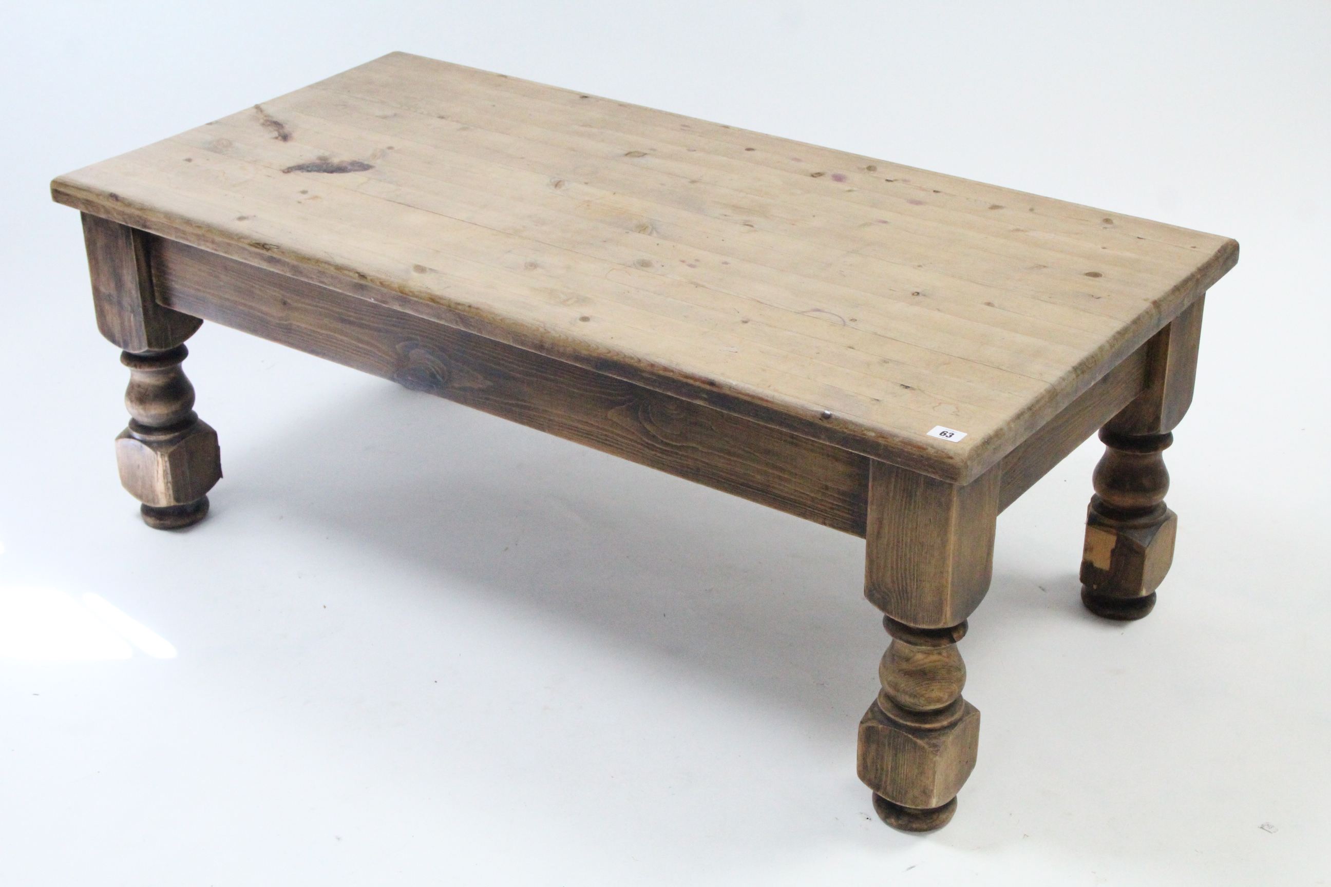 A pine rectangular low coffee table on short turned legs, 48” wide; an oak rectangular low coffee