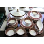 A Royal Doulton bone china “Buckingham” pattern thirty-five piece dinner service (settings for