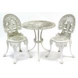 A white painted cast aluminium garden table with pierced circular top & on three shaped legs, 27”