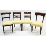 A pair of 19th century mahogany bow-back dining chairs with padded seats & on turned tapered legs;