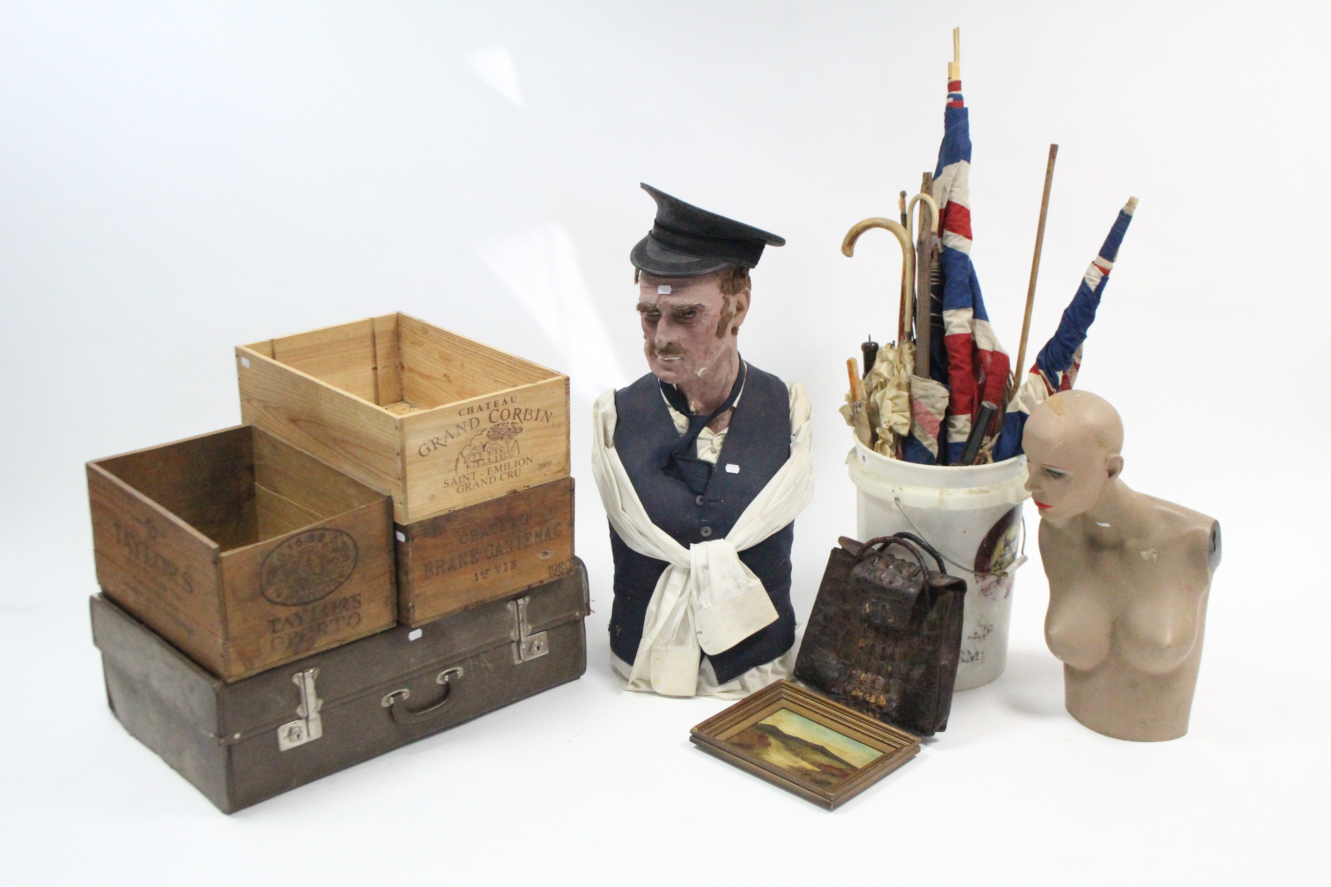 Two mannequins; three wooden crates; various flags & umbrellas; & sundry other items.