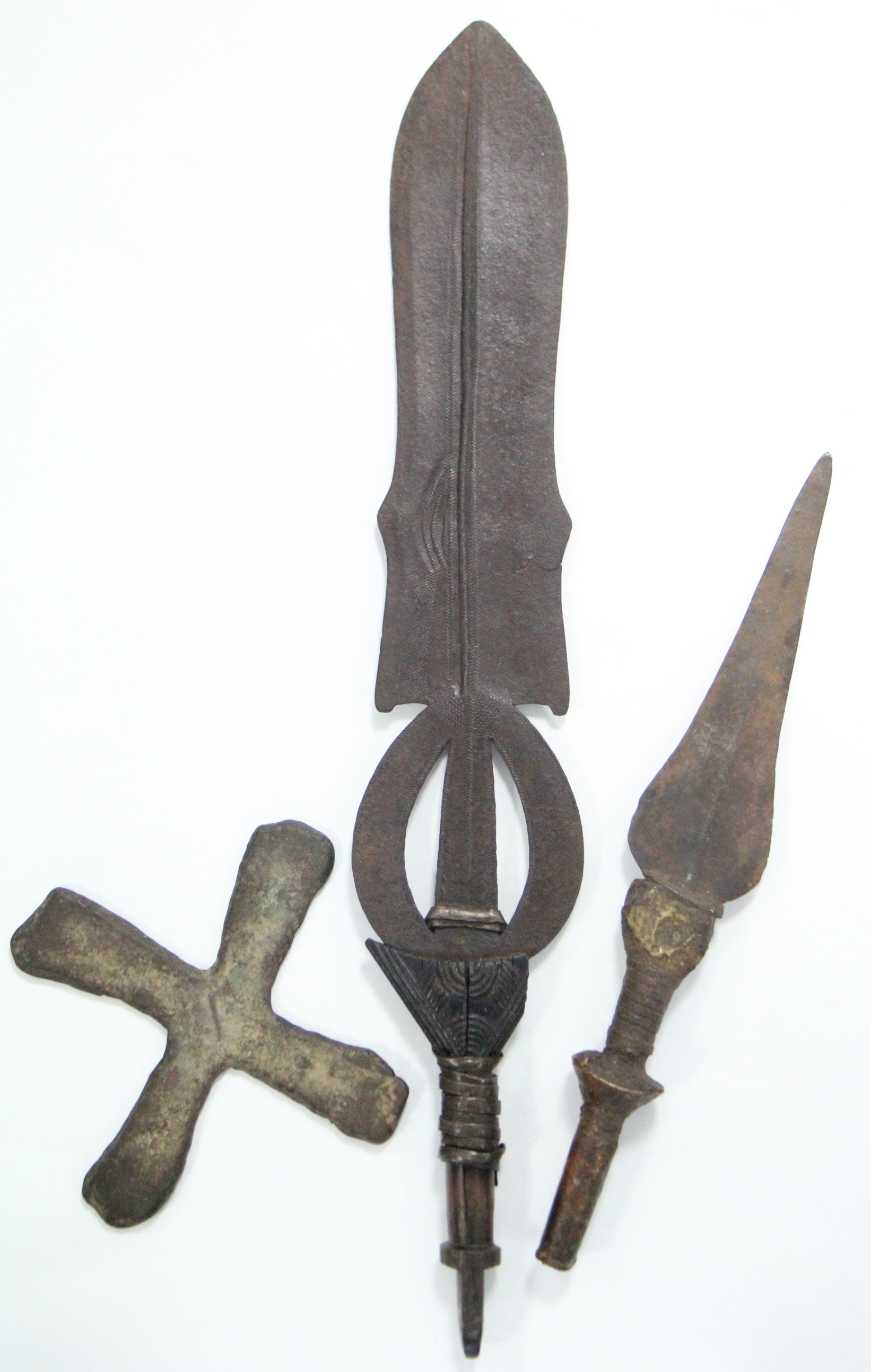 A Congolese ceremonial dagger, the pierced blade with tooled “herringbone” decoration, & with carved