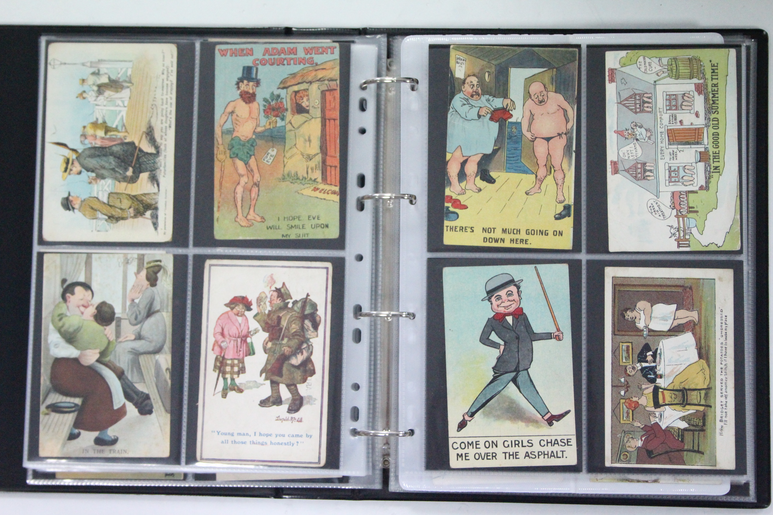 AN ALBUM OF APPROXIMATELY THREE HUNDRED POSTCARDS, EARLY-MID 20th CENTURY – MILITARY, ARTIST-