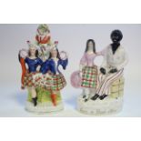 A Victorian Staffordshire pottery flat-back figure group titled: “Eva & Uncle Tom” in gilt script to