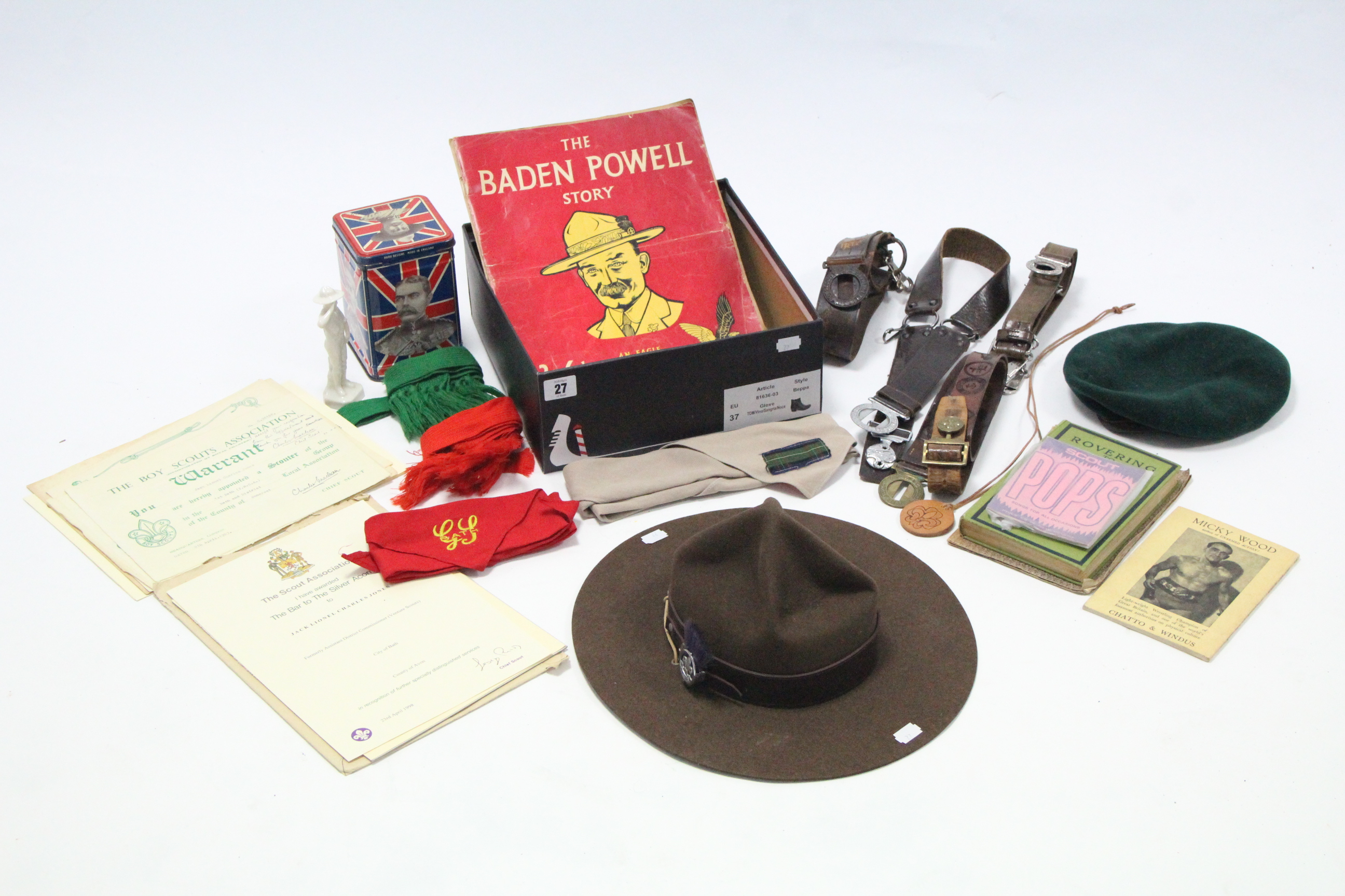 A Boy Scout leader’s wide-brimmed hat; a Boy Scout’s cap; various Boy Scouts belts & neckerchiefs,