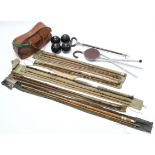 Five cane fishing rods; two shooting sticks; & a set of four lawn bowls.