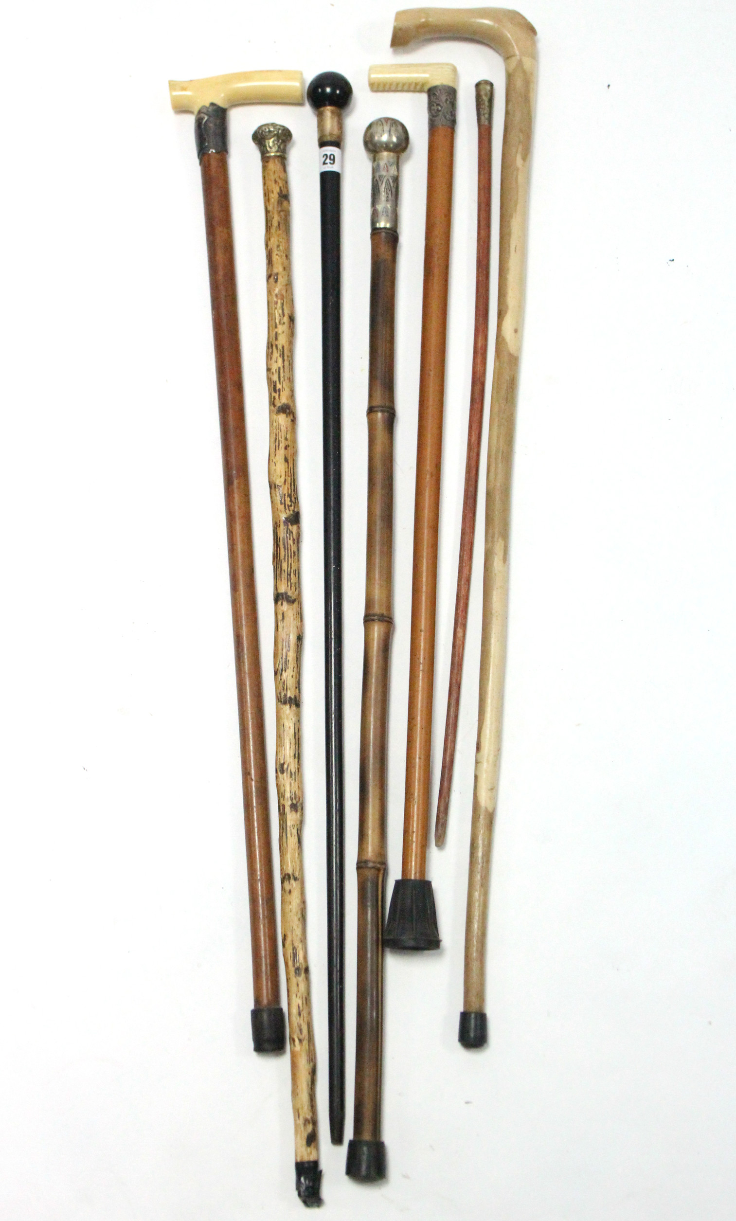 An Edwardian ebonised gent’s walking cane with 18ct. gold plated mount; together with five other - Image 2 of 2