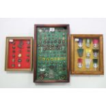 A collection of approximately eighty various Boy Scout badges & tunic buttons, contained in three