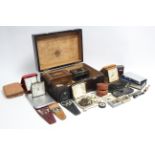 Three pocket compasses; four silver dance medals; two plated cigarette cases; three travelling alarm